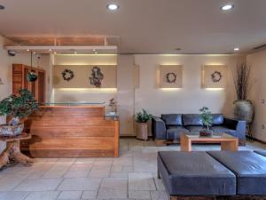 a living room with a couch and a table at Fiscardo Bay Hotel in Fiskardo