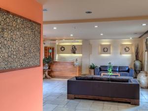 a lobby with a couch and a waiting room at Fiscardo Bay Hotel in Fiskardo