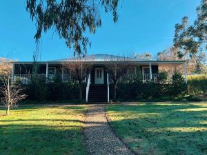 a house with a lawn in front of it at The Birches Beechworth in Beechworth