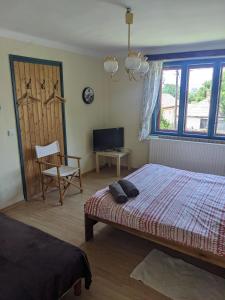Posteľ alebo postele v izbe v ubytovaní Guest house Magyar Route 66