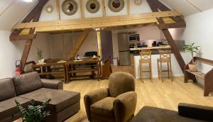 a living room with a couch and a table at Peyranère in Urdos