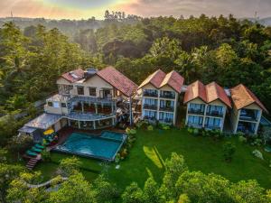 an aerial view of a house with a swimming pool at Zen Koggala by Sugar Coliving in Habaraduwa Central