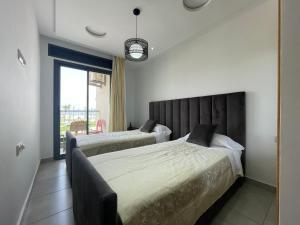 Voodi või voodid majutusasutuse Seafront High Standard Apartment toas