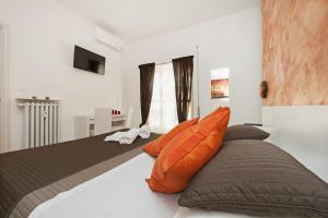 A bed or beds in a room at De Guestibus