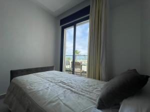 Voodi või voodid majutusasutuse Seafront High Standard Apartment toas