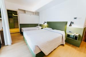 Postel nebo postele na pokoji v ubytování Hotel La Serena