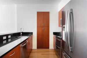 A kitchen or kitchenette at Fenway 1BR w Gym steps from Fenway Park BOS-374