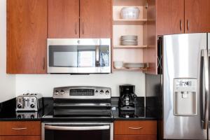 A kitchen or kitchenette at Fenway 1BR w Gym steps from Fenway Park BOS-374
