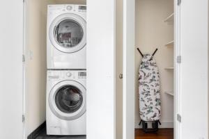 a laundry room with a washer and dryer at East Village 1br w wd nr First Park NYC-1035 in New York