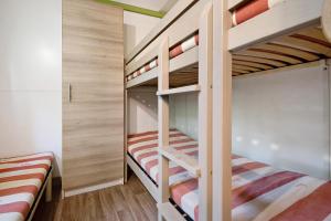 Ένα ή περισσότερα κρεβάτια σε δωμάτιο στο chalet nel bosco