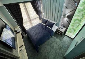 a bedroom with a bed and a large window at Forever 21 Hotel in Istanbul