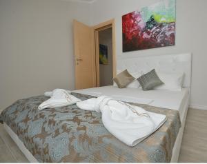 Postel nebo postele na pokoji v ubytování Apartments Mianiko