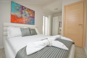 Postel nebo postele na pokoji v ubytování Apartments Mianiko