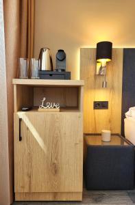 A kitchen or kitchenette at Villa Bauhaus Wellness Apart-Hotel