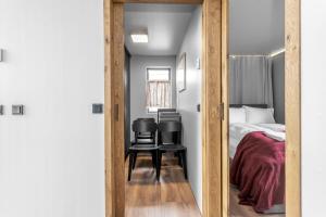 Una cama o camas en una habitación de Selfoss Modern Cabins