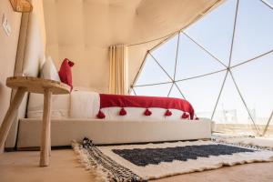 a bedroom with a bed in a tent at Desert Sands Dakhla in Dakhla