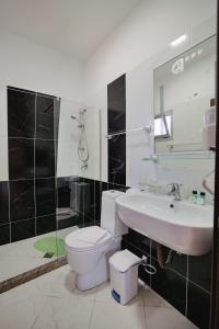 Koupelna v ubytování Grand Hotel Aita