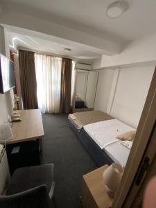 Voodi või voodid majutusasutuse Hotel Skala toas
