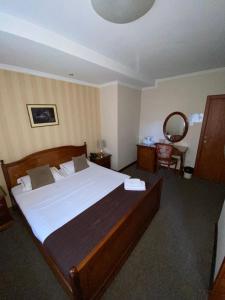 Voodi või voodid majutusasutuse Hotel Skala toas