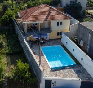 an overhead view of a house and a swimming pool at Villa UpTown in Mostar