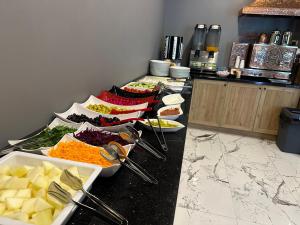 a buffet line with many different dishes of food at Poyraz Hotel Uzungöl in Uzungöl