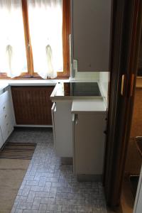 a kitchen with a sink and a window in it at L'appartamento della Stazione di Saronno in Saronno