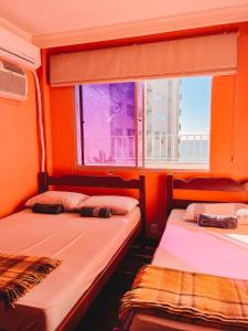 Cama o camas de una habitación en Apartamento BC com vista para o mar