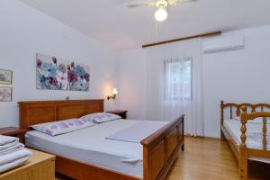 Postel nebo postele na pokoji v ubytování Apartments Marija