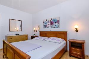 Postel nebo postele na pokoji v ubytování Apartments Marija