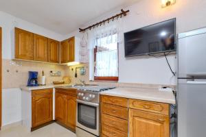 Kuchyň nebo kuchyňský kout v ubytování Apartments Marija