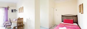 Łóżko lub łóżka w pokoju w obiekcie Sunny Apartments - ex Zoi Studios