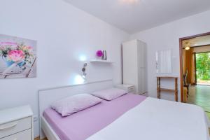 Postel nebo postele na pokoji v ubytování Apartments Marija