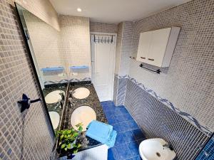 a bathroom with two sinks and a toilet at Your home in Valencia in Valencia