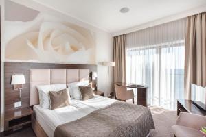 Postel nebo postele na pokoji v ubytování Hotel Różany Gaj - Destigo Hotels