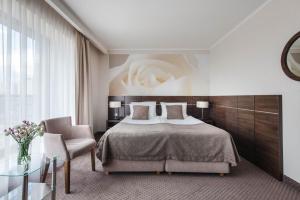 Postel nebo postele na pokoji v ubytování Hotel Różany Gaj - Destigo Hotels