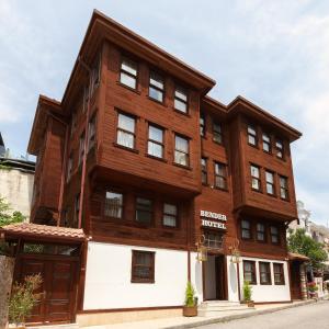 an apartment building with a wooden facade at Bender Hotel in Istanbul