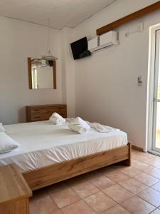 Postel nebo postele na pokoji v ubytování Hotel Hermes