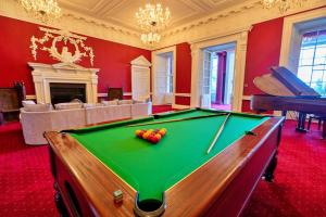 a billiard room with a pool table in it at Finest Retreats - Hickleton Hall Estate in Doncaster