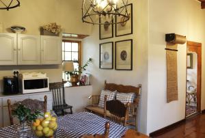 a kitchen with a table and a dining room at Sionsberg Farmstay in Riversdale