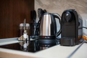 a coffee pot sitting on top of a counter at Abstract Apartment in Varna City