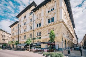 a large building on the corner of a street at Venus Apartments - Market Hall I in Budapest