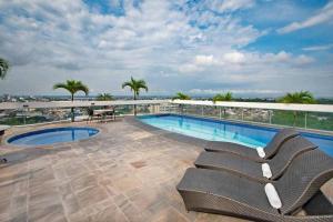 a swimming pool on the roof of a building at Flat Millennium - Suíte 809 in Manaus