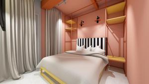 a bedroom with a white bed in a pink room at Hotel Graziella in Bellaria-Igea Marina