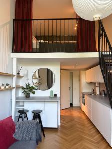 a kitchen and living room with a loft conversion at M Loft2 in Kaunas