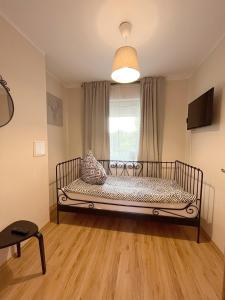 a bedroom with a bed in a room with a window at 15 Gdynia Centrum - Apartament mieszkanie dla 7 osób in Gdynia