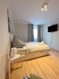 Кровать или кровати в номере 15 Gdynia Centrum - Apartament mieszkanie dla 7 osób