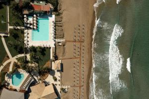 an overhead view of the beach and the ocean at Domes of Corfu, Autograph Collection in Glyfada