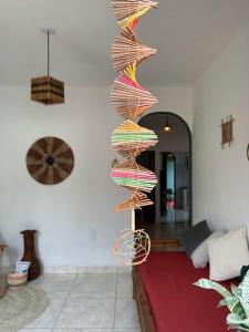a colorful wire sculpture in a living room at Terra Hostel e Pousada in Lençóis