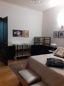 Postel nebo postele na pokoji v ubytování La casa di Gatsby Art Deco in Centro Gorizia con Parcheggio e Terrazza