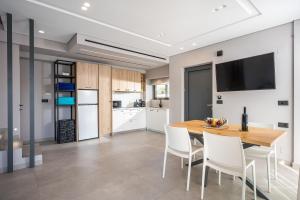 A kitchen or kitchenette at Aida Luxury Villas